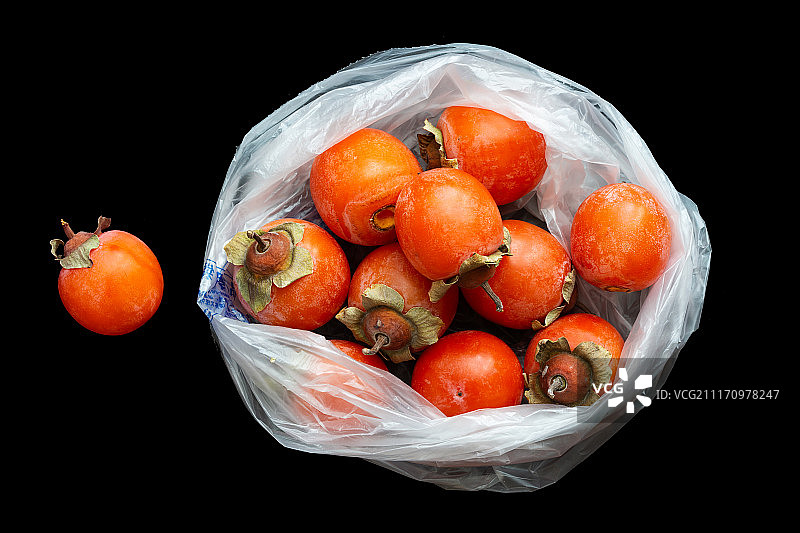 塑料袋里的柿子图片素材