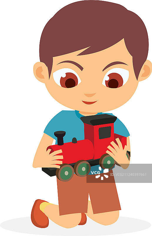快乐的小男孩在玩他的红色玩具火车图片素材