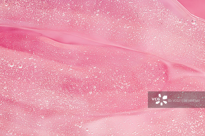 抽象的粉红色液体背景，油漆飞溅，漩涡图案和水图片素材