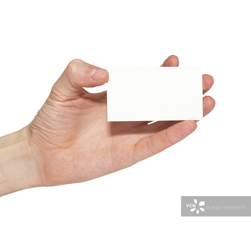 手拿灰色空白卡，裁切的手拿着空白纸在白色背景下图片素材