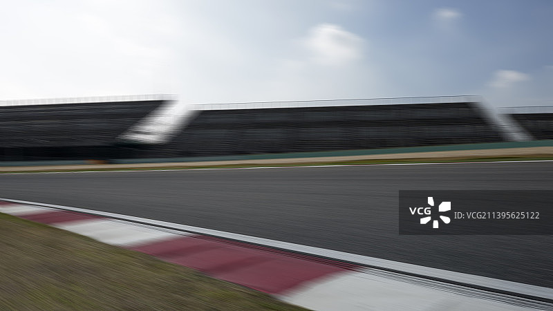 逆光F1赛道运动模糊速度特效弯道图片素材