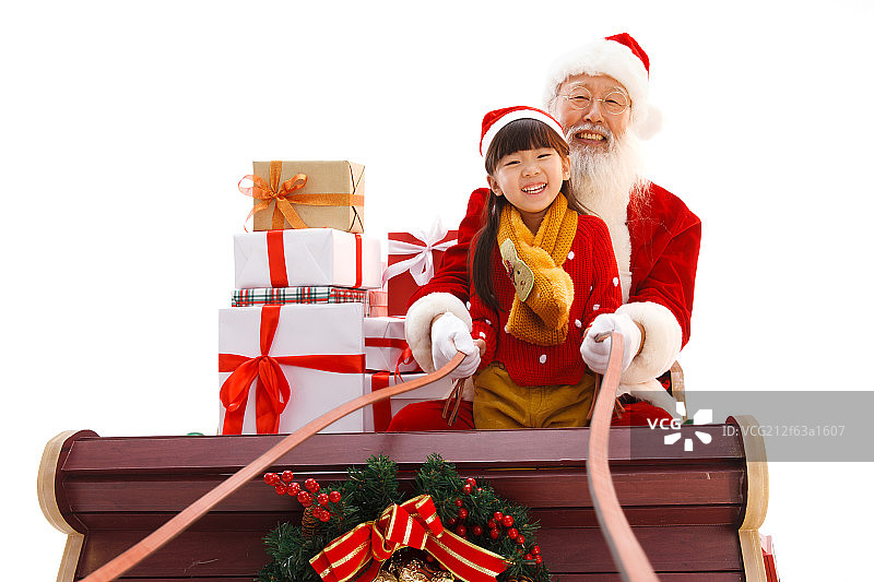 圣诞老人和小女孩在派送圣诞礼物图片素材