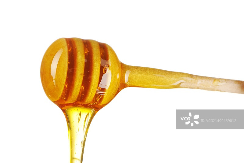勺和蜂蜜孤立在白色图片素材
