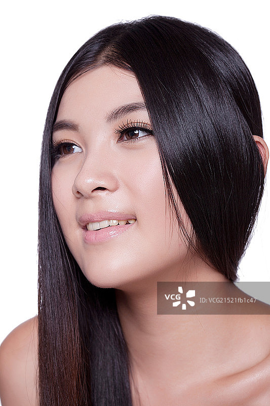 年轻女人亮丽丝缎般的头发图片素材