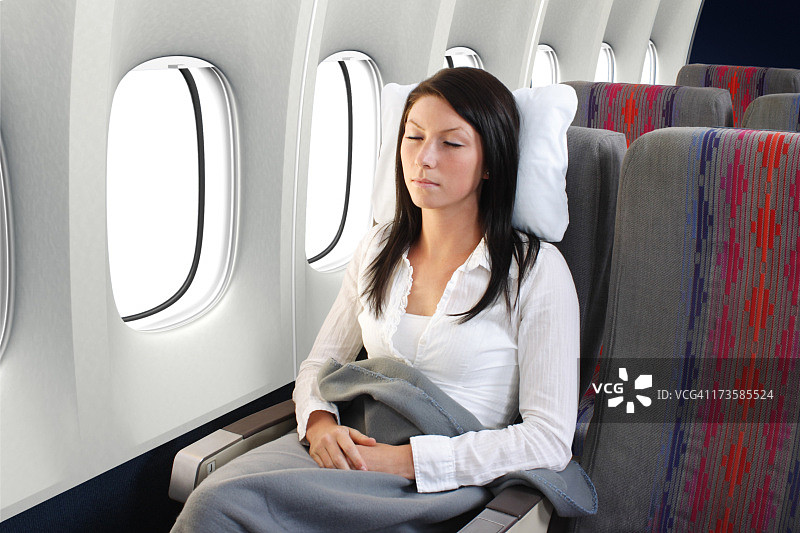 乘客在飞机上睡觉图片素材