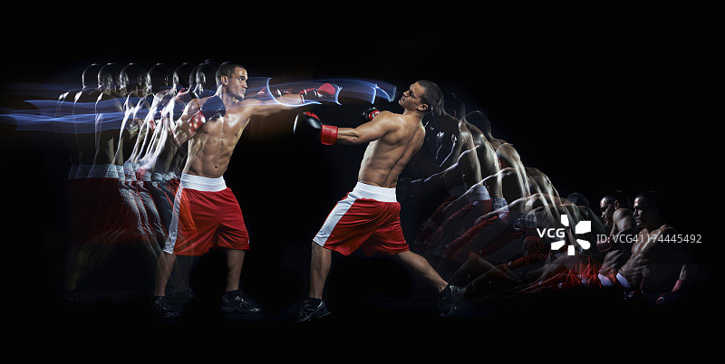 一个拳击手用多个频闪器打另一个拳击手图片素材