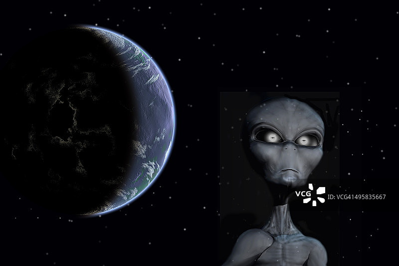 一个灰色外星人站在外太空背景下，行星地球。图片素材