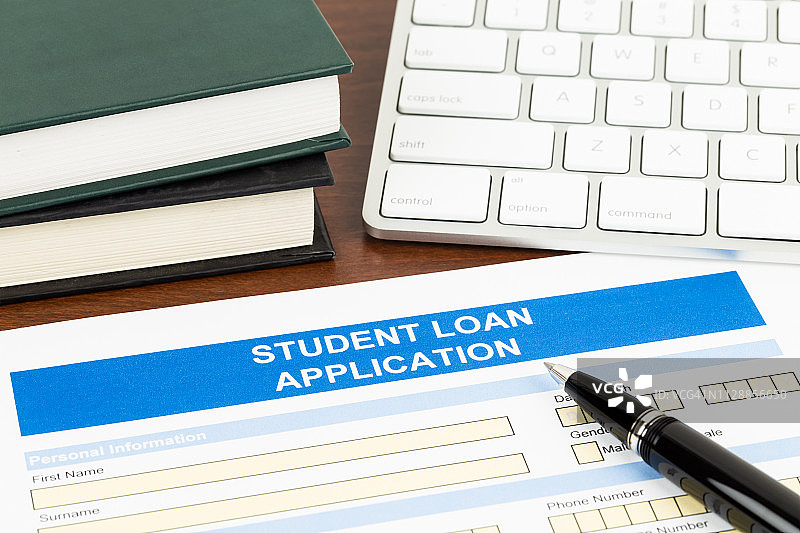 学生贷款申请表、笔、键盘、课本图片素材