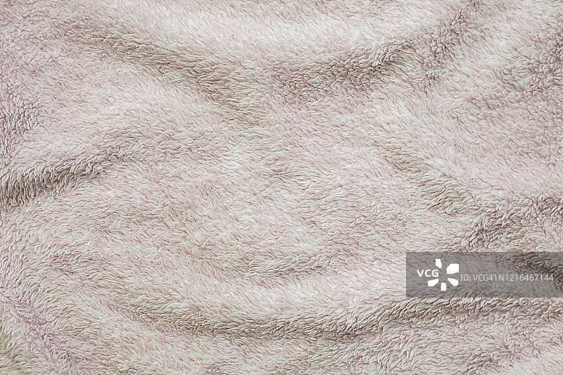 粉色针织毛衣面料作为背景。图片素材