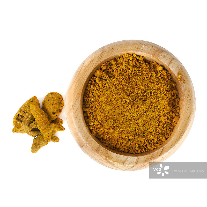 姜黄粉与姜黄根放在木碗里图片素材