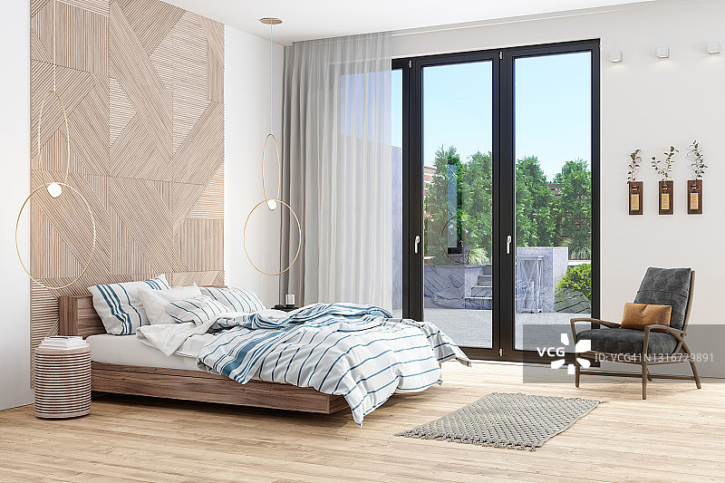现代卧室的内部配备木制床家具，扶手椅和花园景观从窗口图片素材