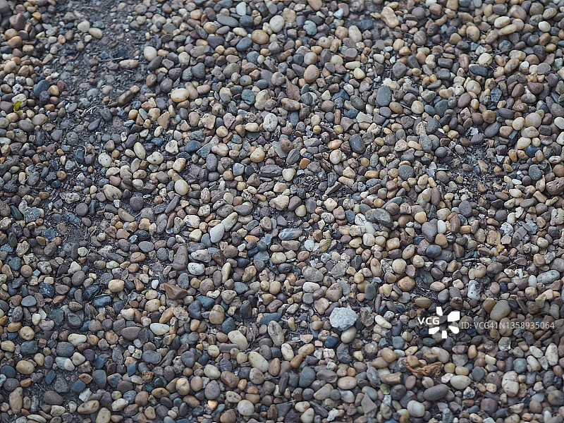 摘要背景用鹅卵石小圆海石海滩岩石纹理材质自然，岩石的细节，灰色黑色的颜色图片素材
