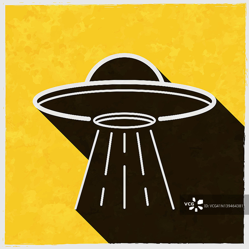 UFO -带有光束的飞碟。图标与长阴影的纹理黄色背景图片素材