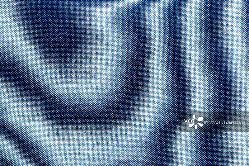 蓝色布布涤纶纹理和纺织背景。图片素材