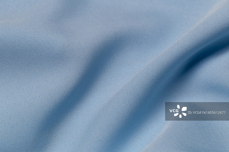 面料呈灰蓝色，布料为涤纶质感和纺织品底色。图片素材