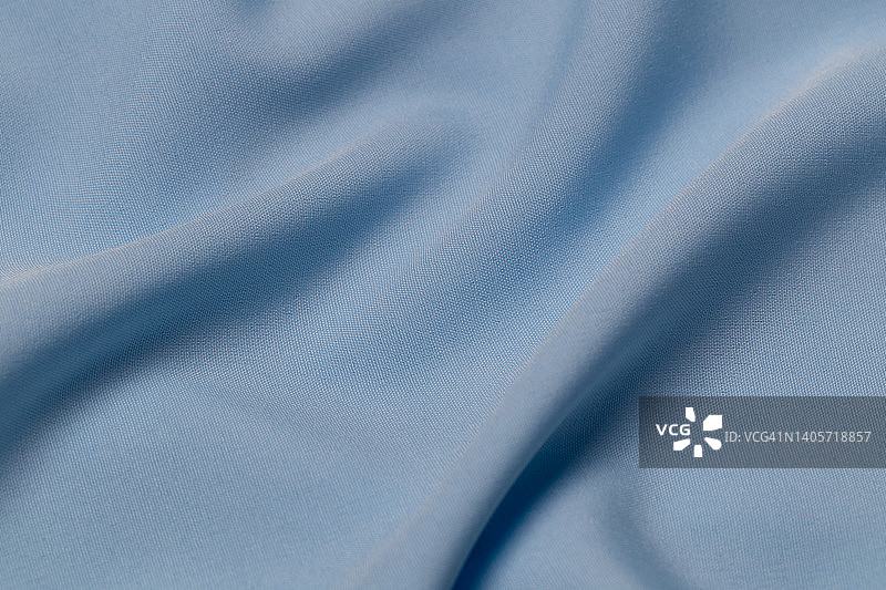 面料呈灰蓝色，布料为涤纶质感和纺织品底色。图片素材