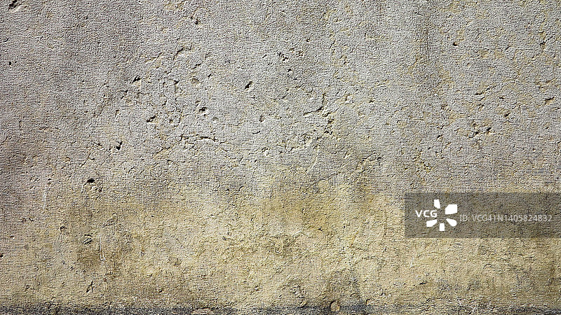 法国巴黎，由风化和磨损的水泥覆盖的Freestone墙图片素材