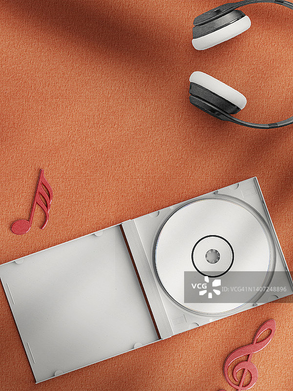 白色背景的耳机和音符。红色的空白CD盒图片素材