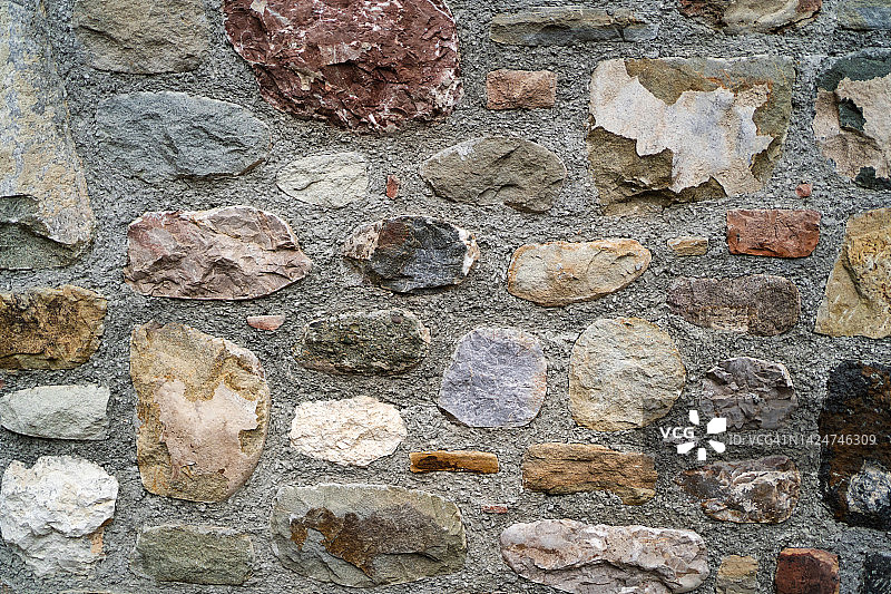 由许多不同的石头制成的纹理墙。你的设计背景图片素材
