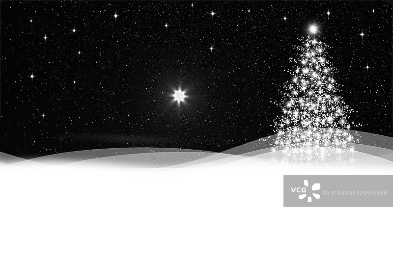 在蓝色雪地背景下闪闪发光的圣诞树图片素材