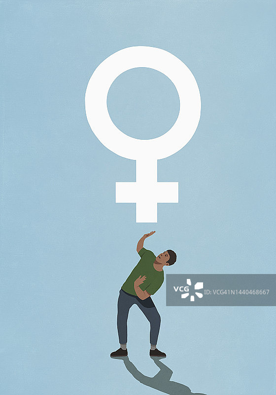 男人蹲在女性的性别符号下面图片素材