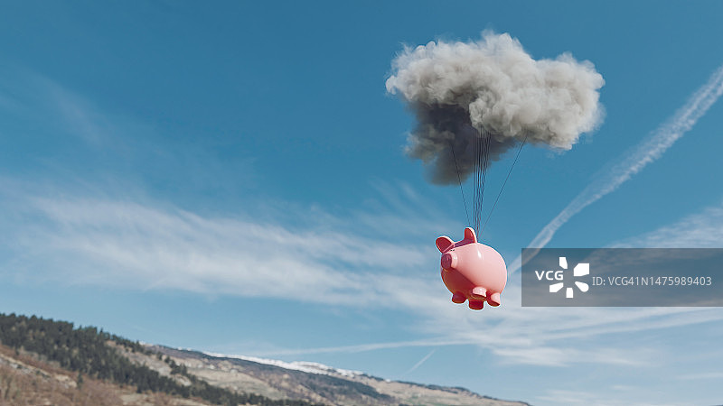 粉红色的存钱罐在空中连接着一朵云图片素材