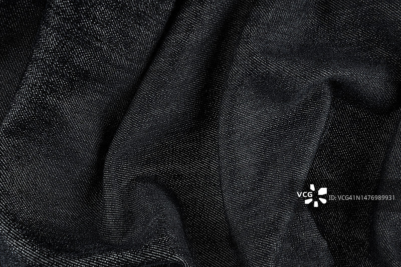 黑色纹理背景细节织物纺织材料画布。图片素材