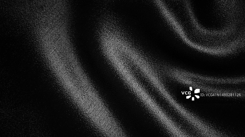光滑优雅的黑色涤纶纺织纹理面料背景。关闭了。图片素材