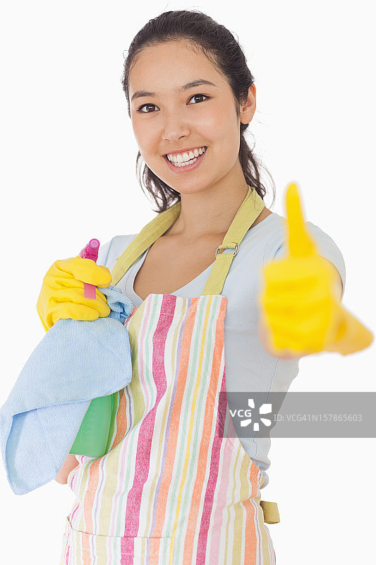 拿着清洁产品的女人竖起大拇指图片素材
