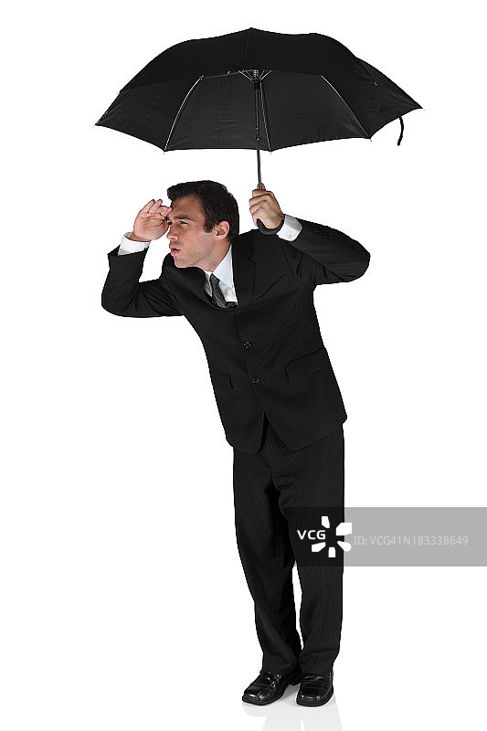 商人在伞下挡着眼睛图片素材