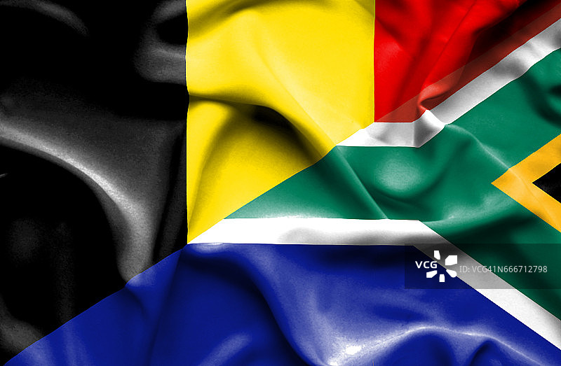 挥舞着南非和比利时的旗帜图片素材