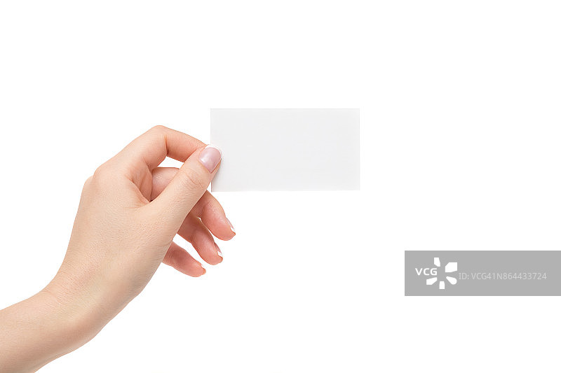 孤立的女性手拿着白色背景上的白色卡片。图片素材