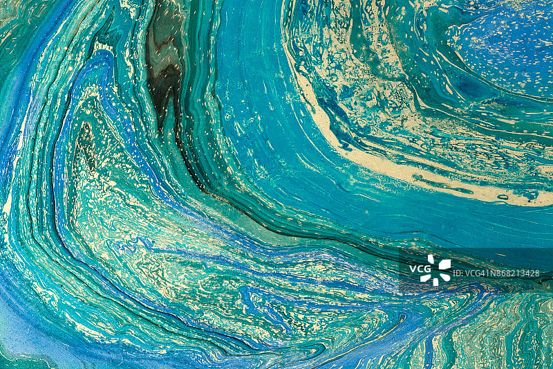 蓝色大理石花纹纹理。创意背景与抽象油画波浪手工表面。液体涂料。图片素材