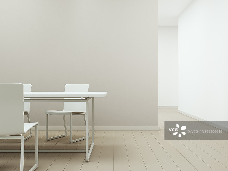 白色桌椅木地板与空米色混凝土墙背景，现代住宅明亮房间的会议或用餐区图片素材