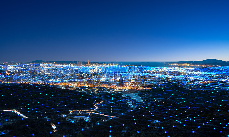 科技线条粒子合成的蓝调城市天际线图片素材