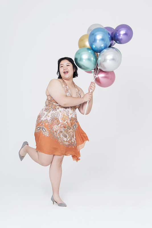 肥胖女人和气球图片素材