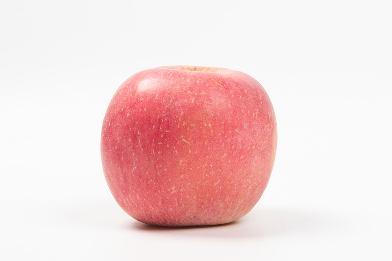 白色背景上的一个新鲜红苹果图片下载