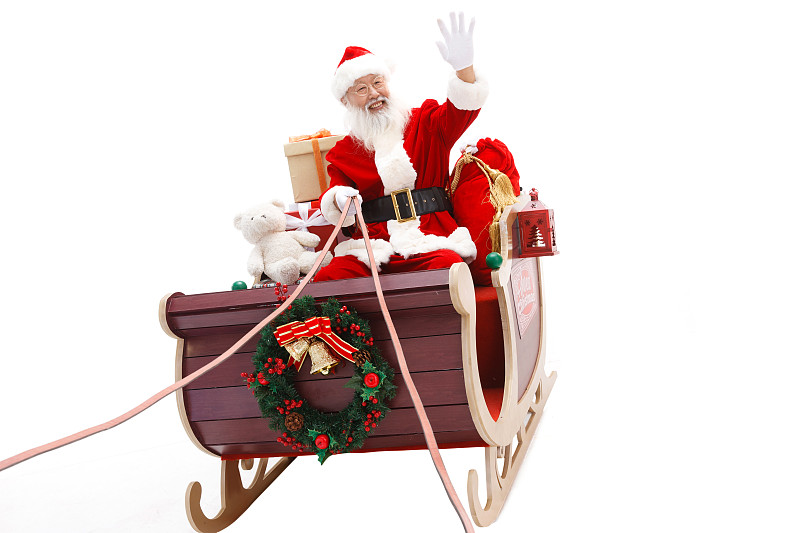 圣诞老人驾着雪橇派送礼物图片下载