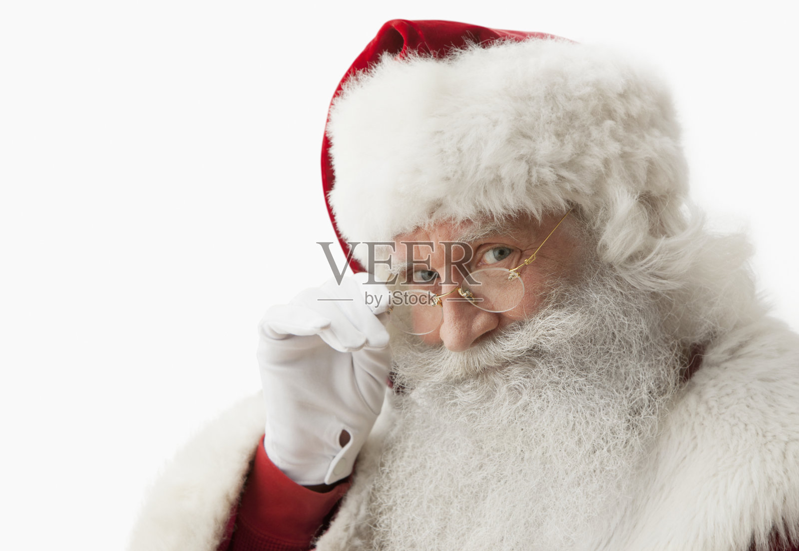 圣诞老人触摸眼镜的特写照片摄影图片