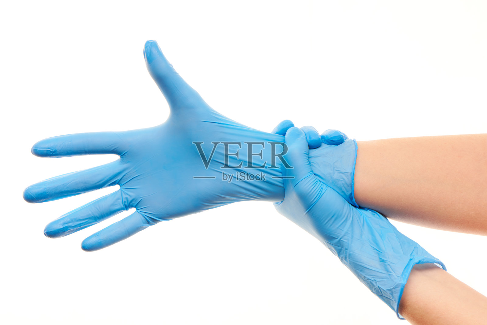女医生的手戴着蓝色消毒手术手套照片摄影图片