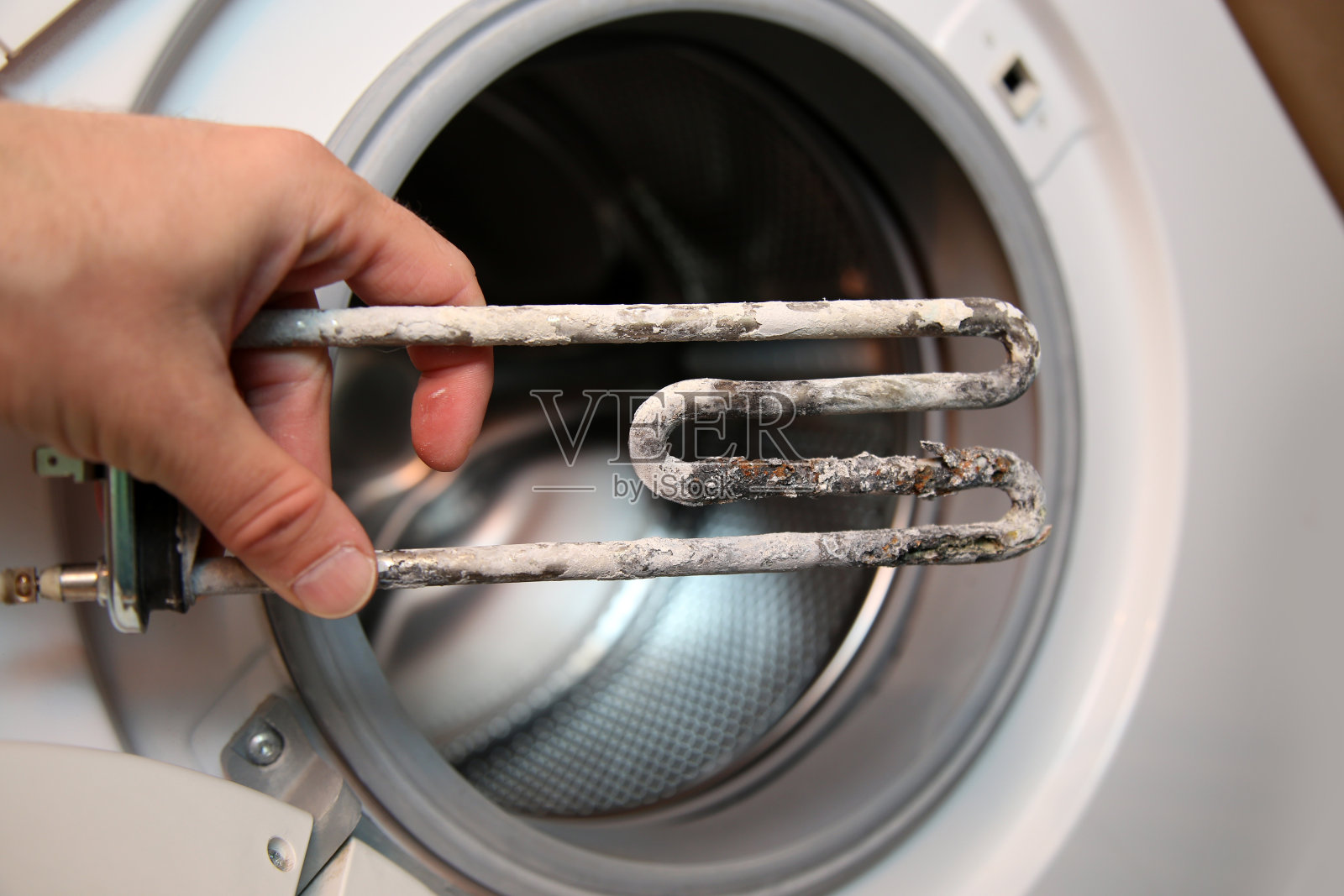 洗衣机的电加热器照片摄影图片