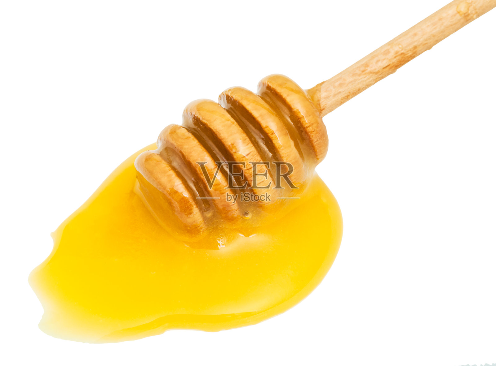 黄色蜂蜜和木棒的水坑照片摄影图片