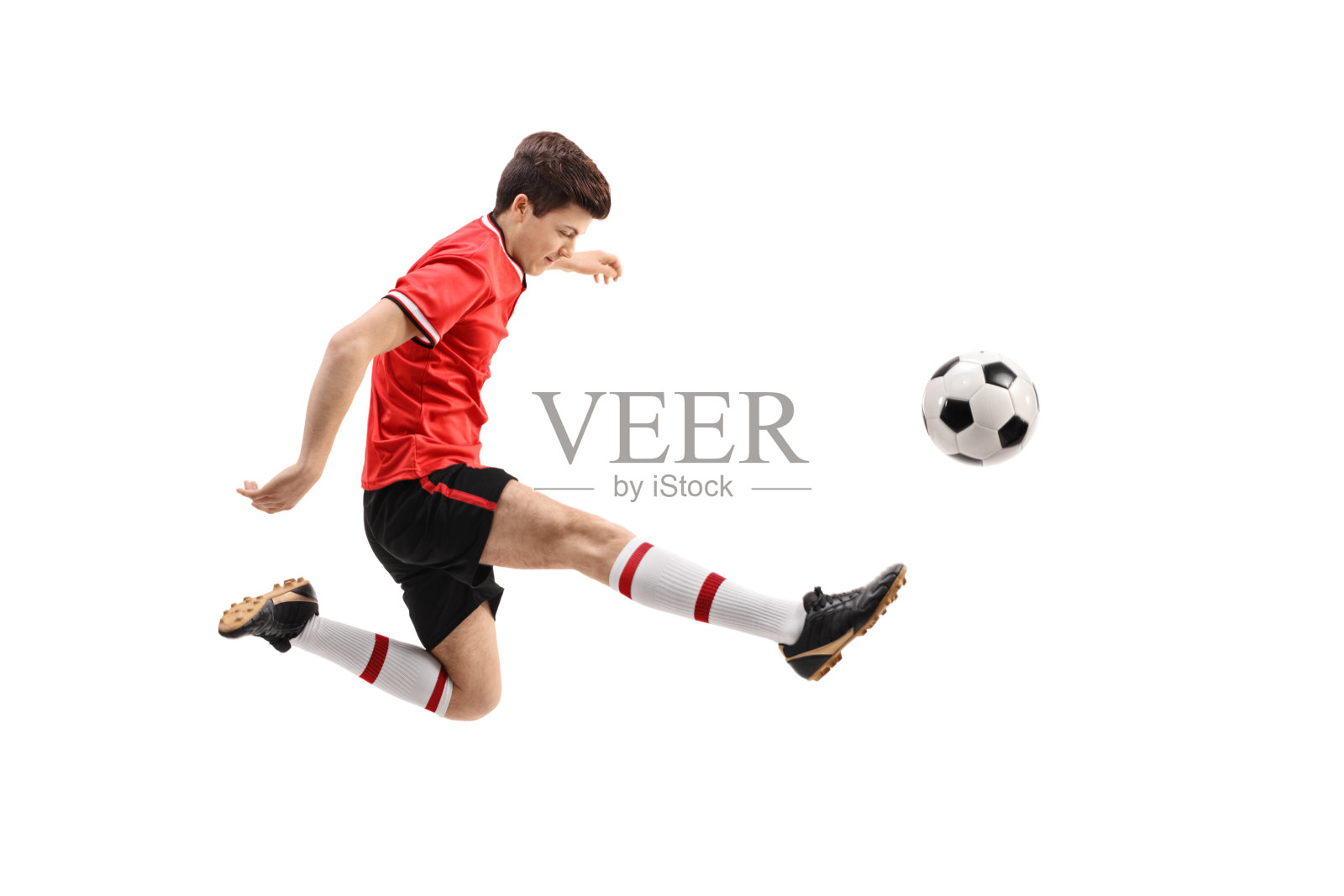 踢足球的少年足球运动员照片摄影图片