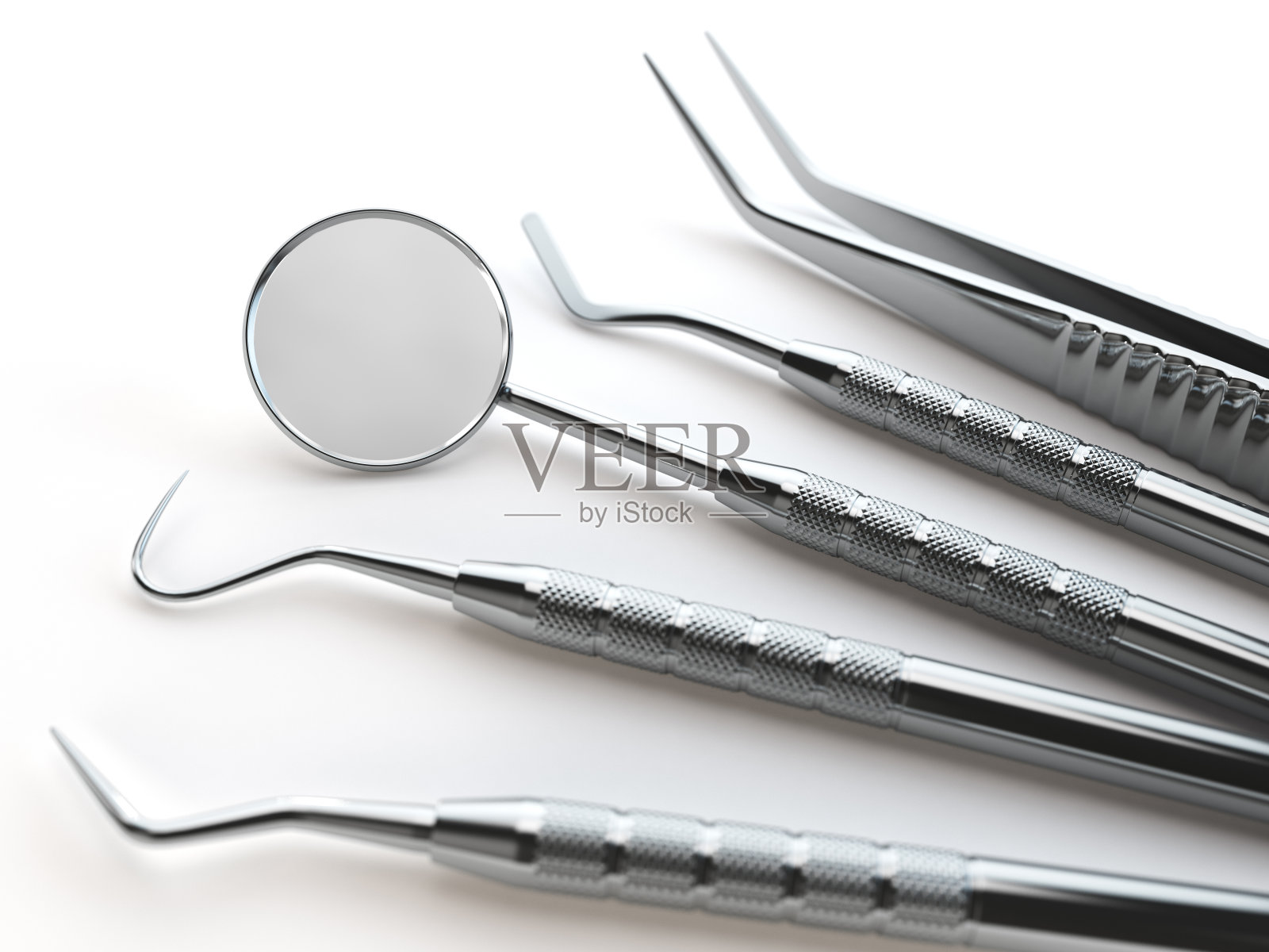 牙科工具套装，用于牙齿的牙齿护理隔离上白。照片摄影图片