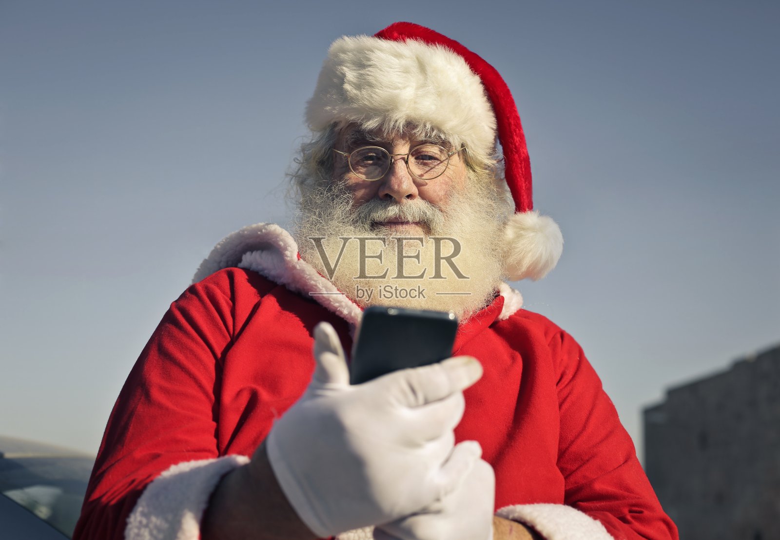 圣诞老人用手机照片摄影图片