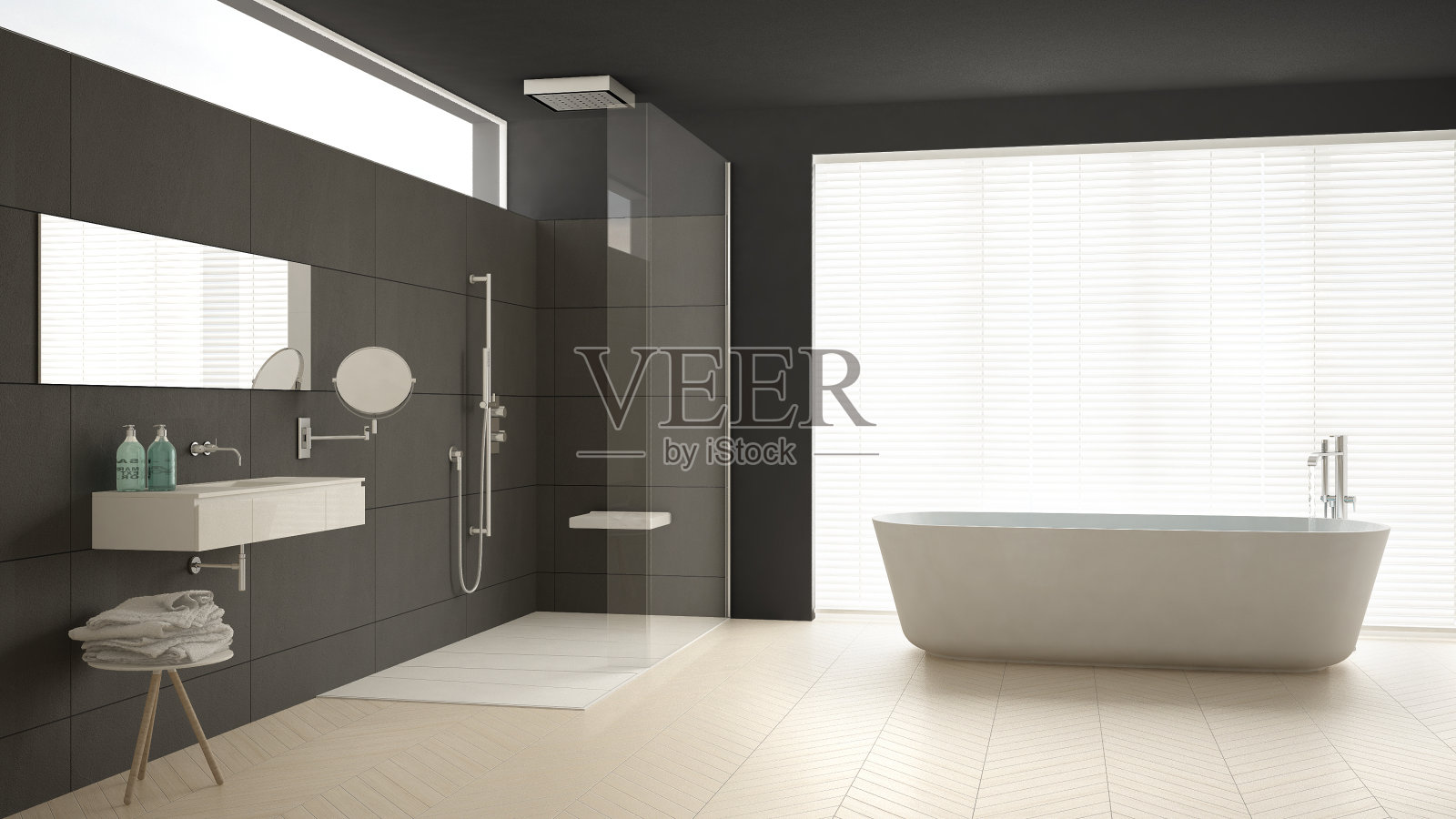 极简主义的浴室配有浴缸和淋浴，拼花地板和大理石瓷砖，经典的灰色室内设计照片摄影图片