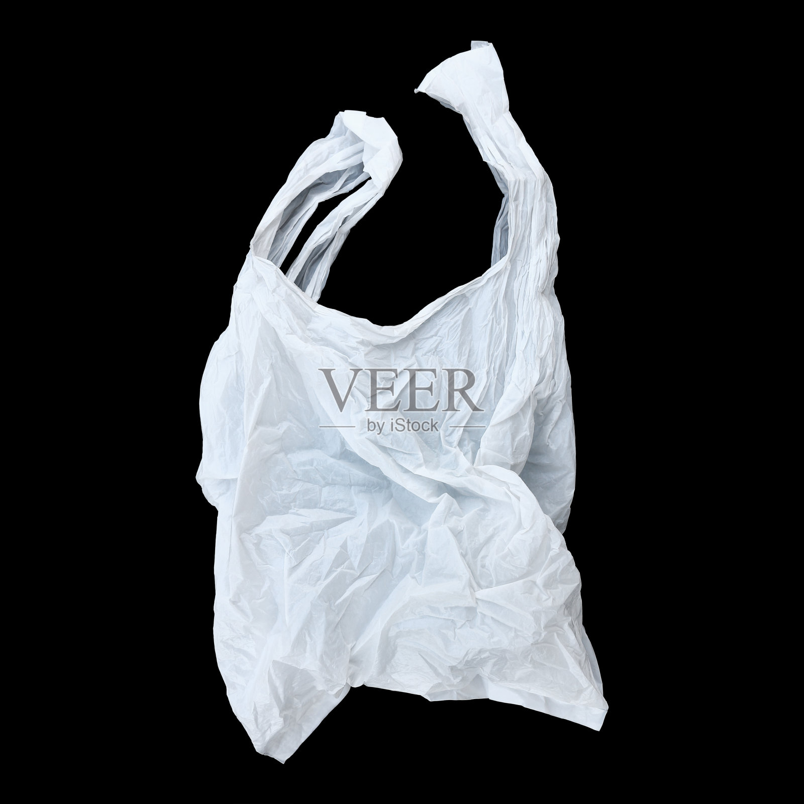 一个白色塑料袋孤立在黑色塑料袋上照片摄影图片