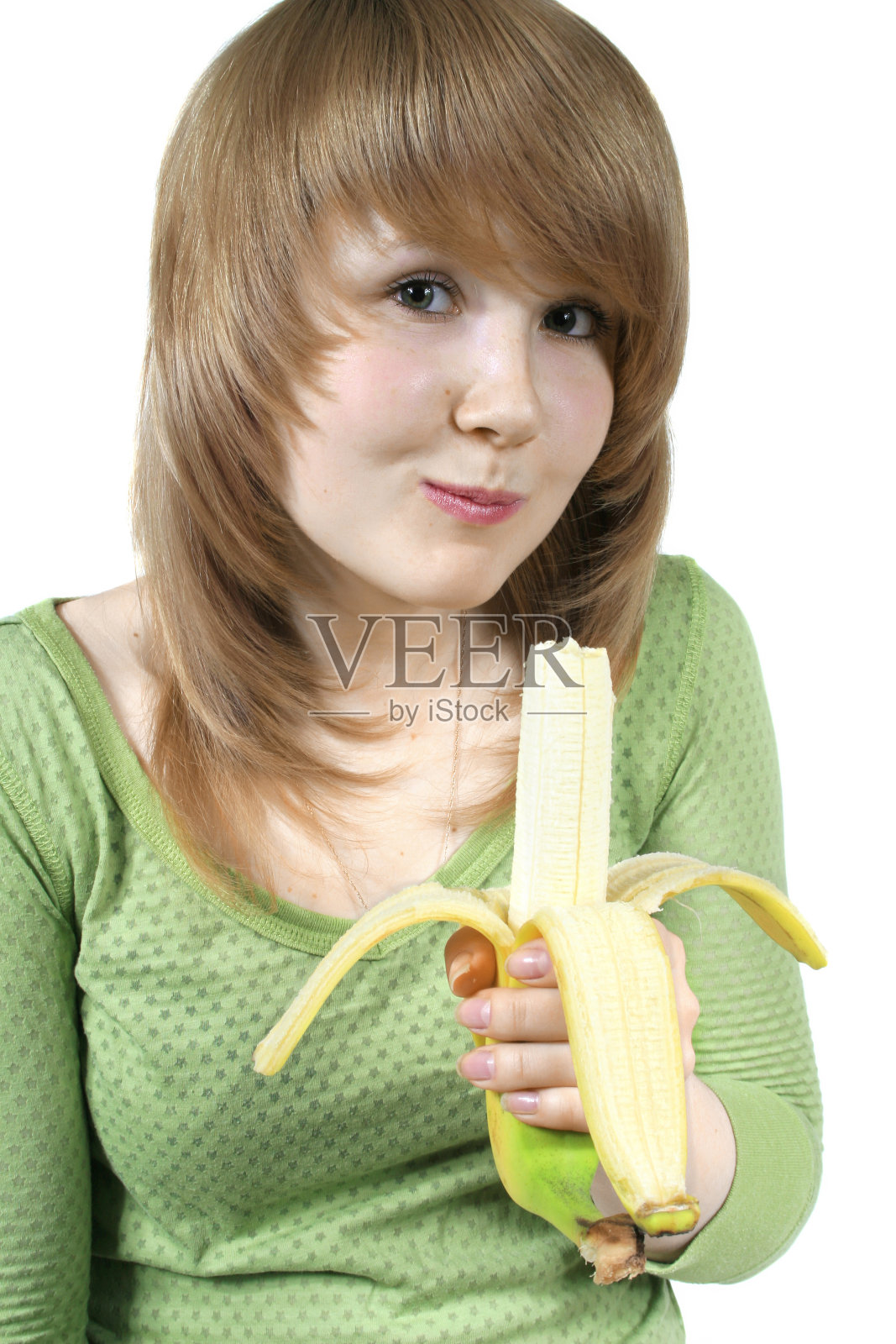 漂亮的金发女孩拿着香蕉照片摄影图片