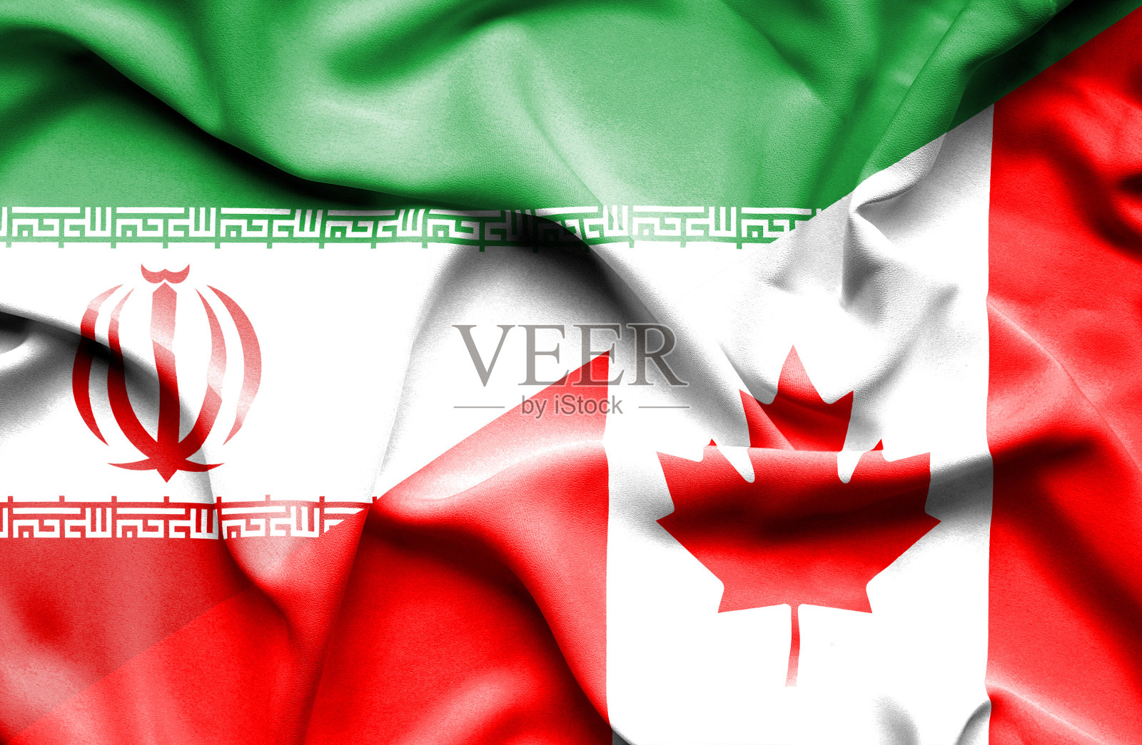 挥舞着加拿大和伊朗的旗帜照片摄影图片
