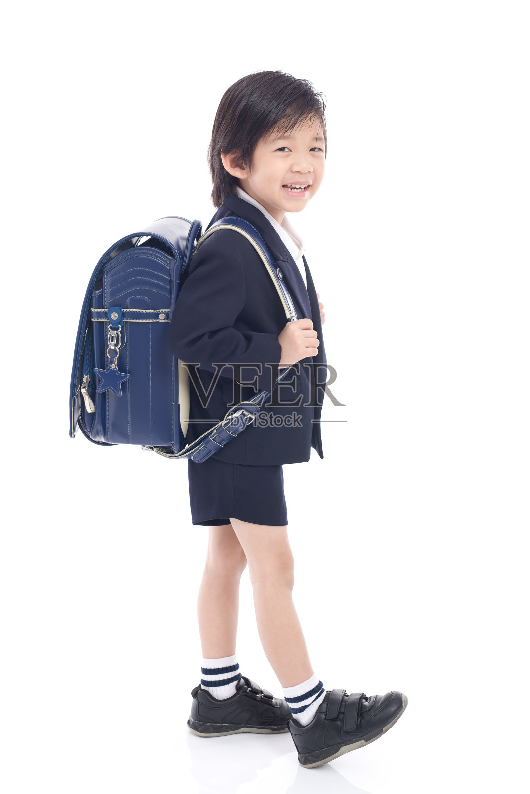 亚洲儿童校服和蓝色书包照片摄影图片
